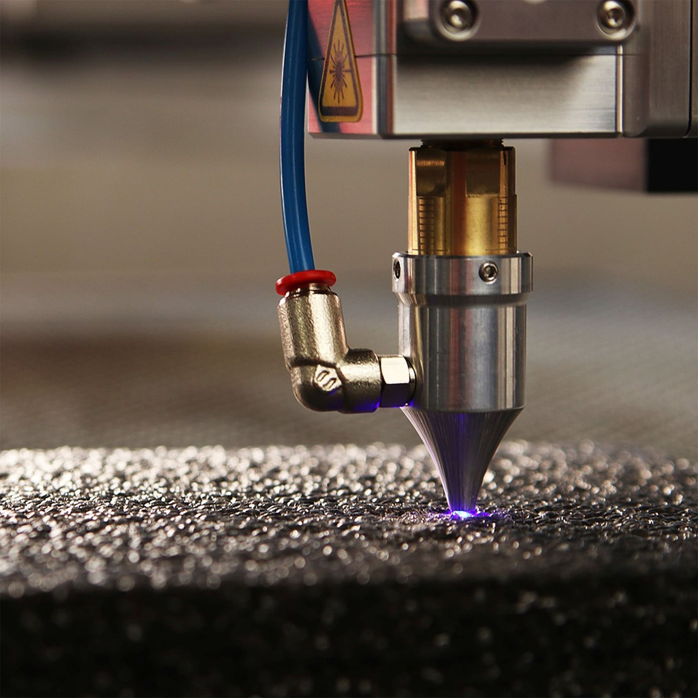 Extreme close-up of the laser focal point on a material surface