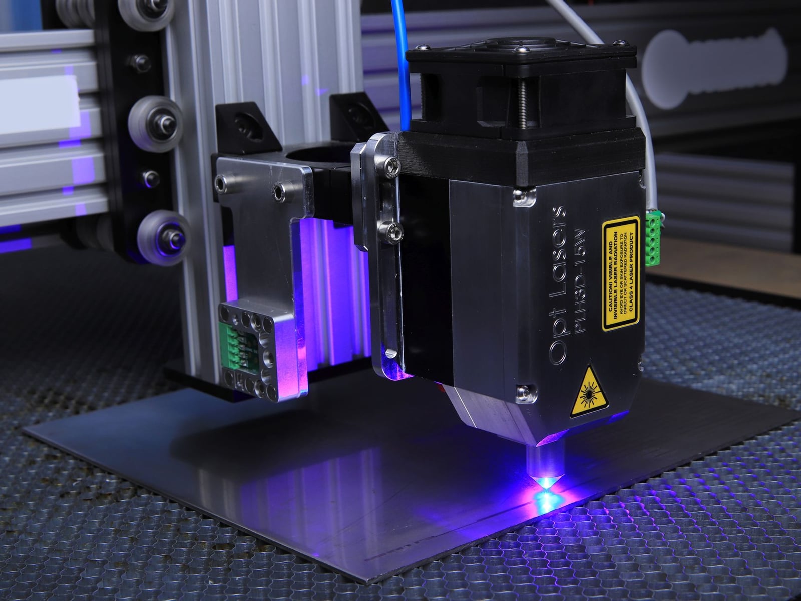Detailed shot of a precise laser engraving on a brushed aluminum surface